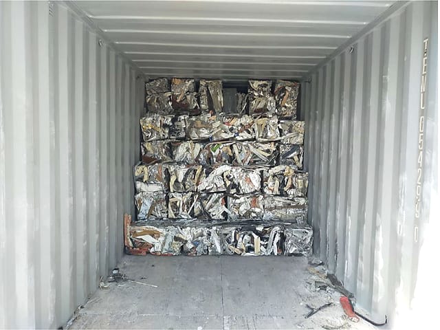 Aluminium scrap bales stowed in a shipping container